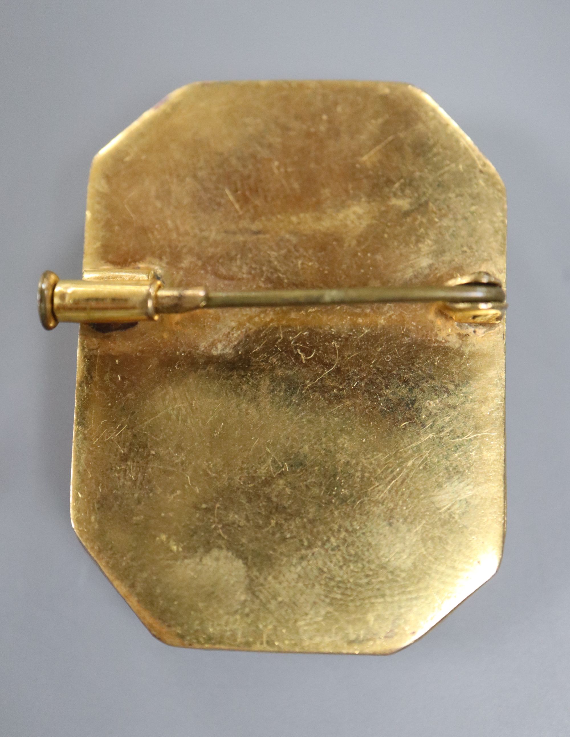 A yellow metal mounted octagonal brooch, with oval painted bust of a lady in mirrored surround, 36mm, gross 16.8 grams.